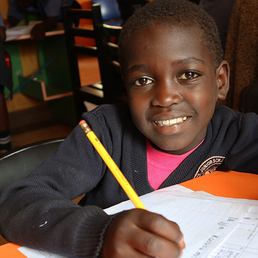 Smiling child studying at desk